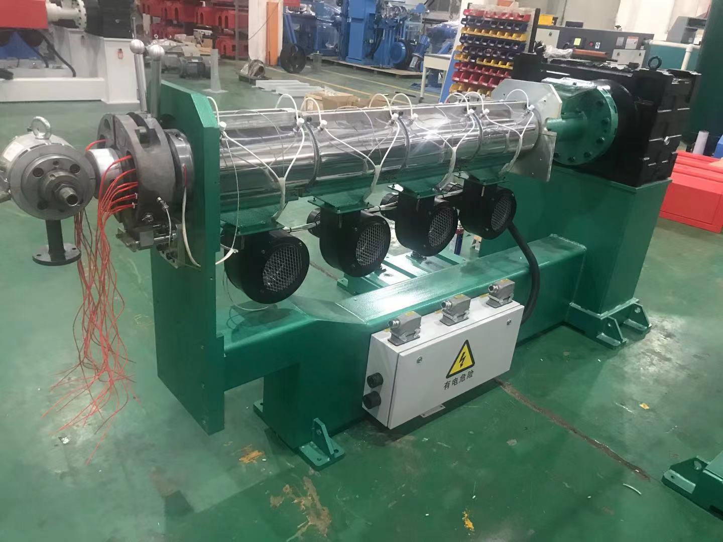 Two extruders are being assembled by our engineer