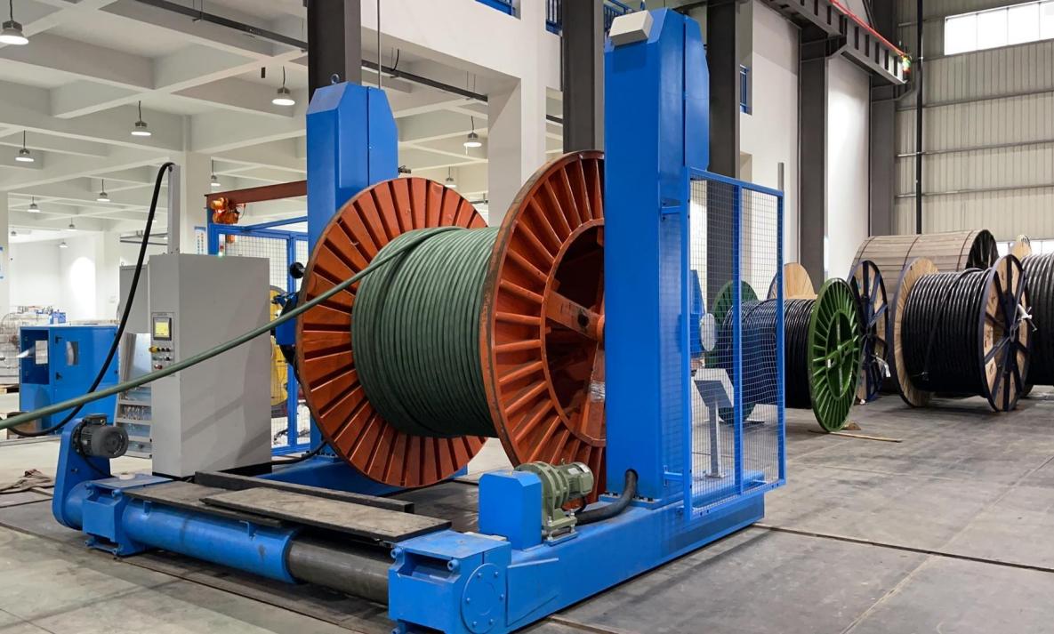 Under-mounted portal type active take up for big size cable